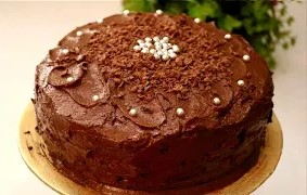 Indulge in the irresistible taste of our Chocolate Cake by Dolce Delights. Baked with premium cocoa and layered with silky chocolate frosting, this cake is designed to satisfy every sweet craving. The soft sponge melts in your mouth, while the creamy filling adds the perfect balance of sweetness. Whether you’re celebrating a birthday, an anniversary, or simply want to treat yourself, this cake is the ultimate centerpiece. Freshly baked and customizable with different sponge and filling options, the Chocolate Cake brings both taste and elegance to your table.